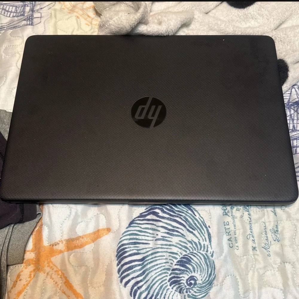Laptop comes with a charger and it works perfect